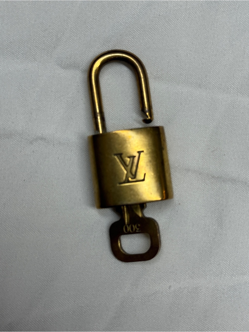 Louis Vuitton Gold Tone Monogram Padlock with Key # 300